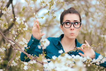 Funny Girl Surrounded by Blossoming Trees Afraid of Allergies