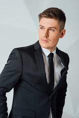Portrait of handsome stylish man in elegant suit
