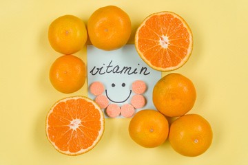 A Sticker with the word vitamin . Background yellow, vitamin C, citrus