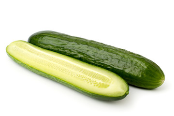 Cucumber and half on a white background, closeup.