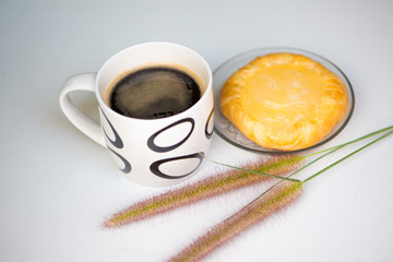 Closed up Cup of coffee and fruit bakery