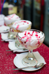 ice cream with syrup in a glass cup