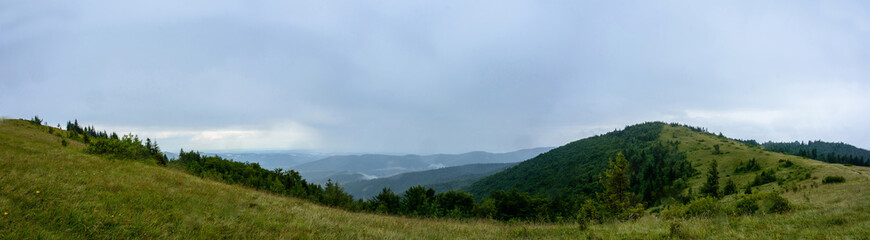 Amazing panorama on the mountain Yavorinka in the Carpathians during the rain