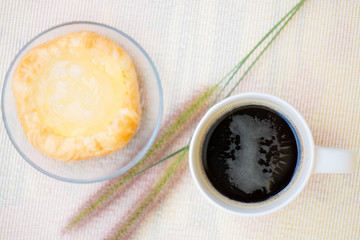 Closed up Cup of coffee and Toddy Palm Pie Pots on dish