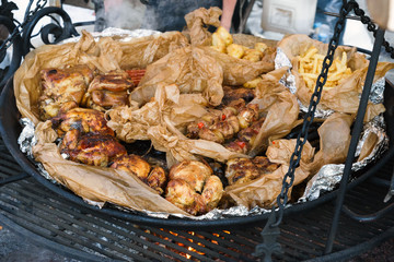 Big barbecue grill of meat. Roasted ribs, chicken, pork, turkey, roast potatoes .