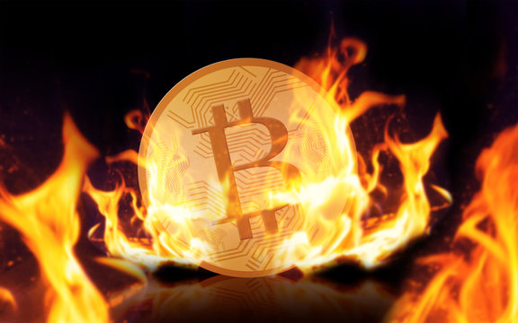 gold bitcoin on fire over black background