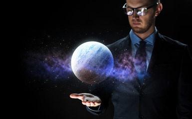 close up of businessman with planet hologram