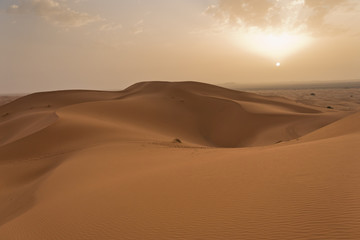 Fototapeta na wymiar Sunrise over sand dunes in Erg Chebbi, Sahara desert, Morocco, Africa