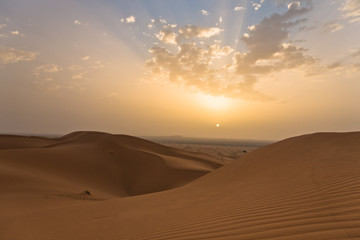 Fototapeta na wymiar Sunrise over sand dunes in Erg Chebbi, Sahara desert, Morocco, Africa