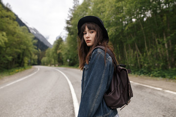 Teenage girls travel and wait on road