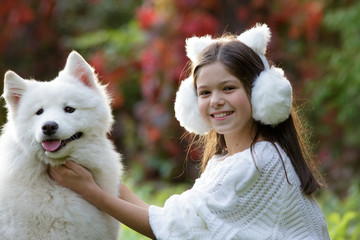 Girl playing with her dog