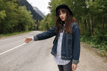 Teenage girls travel and wait on road