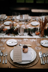 Set tables for fancy dinner in a green house