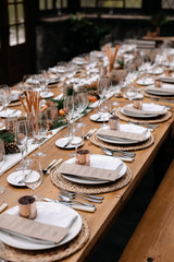 Set tables for fancy dinner in a green house