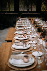 Set tables for fancy dinner in a green house