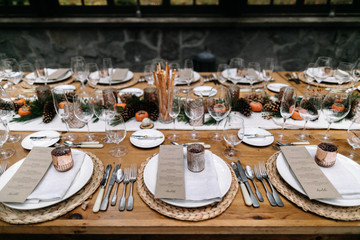 Set tables for fancy dinner in a green house
