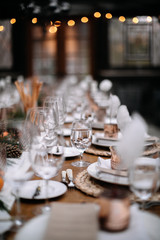 Set tables for fancy dinner in a green house