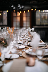 Set tables for fancy dinner in a green house
