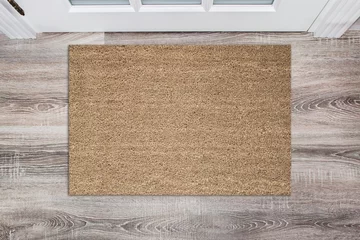 Foto op Plexiglas Blank tan colored coir doormat before the white door in the hall. Mat on wooden floor, product Mockup © maddyz