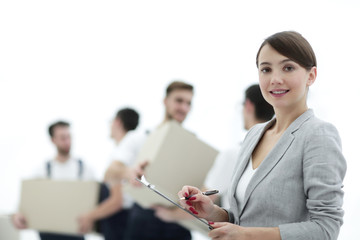Businessman with documents, creating a stack of cardboard boxes.