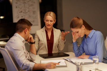 business team with laptop working late at office