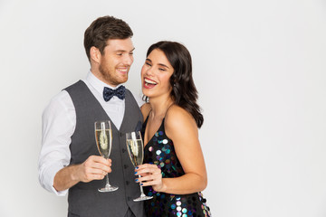 happy couple with champagne glasses at party
