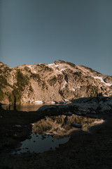 reflecting mountain with snow in sunset