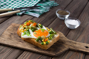 fried egg with mexican vegetable mix and bread
