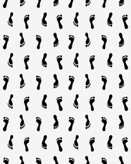 Seamless pattern with prints of human feet 