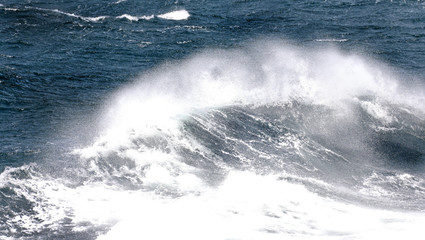 Blue ocean wave on Windy Rough sea day. Cruise ship Vacation. Big surf.
