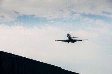 Fototapeta na wymiar Airplane is approaching runway to land at airport