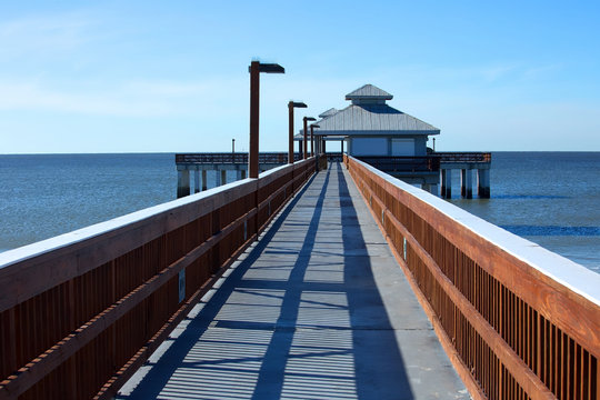 Fort Myers Beach Fishing Pier located at Times Square a popular tourist destination in Fort Myer Beach, Florida, USA. 