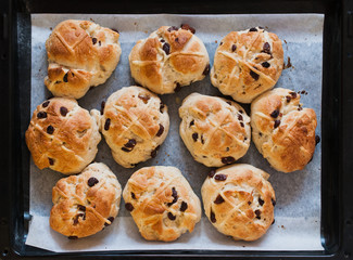 Homemade Hot Cross buns, spiced sweet buns with raisins and cross on top, traditionally eaten in the UK and other Christian countries for easter celebrations on Good Friday after lent