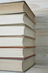 Pile of old books stacked on top of each other.