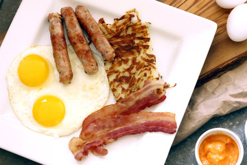 Sausage with bacon, eggs, and hash browns