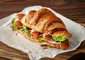 Croissant sandwich with cucumber and ham