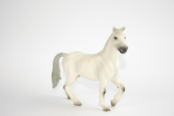 Obraz na płótnie Canvas white horse figure on white background
