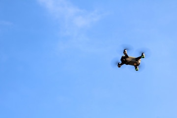 Drone camera or UAV flying in the blue sky
