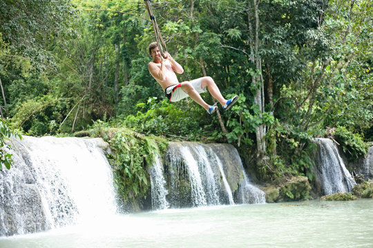 Swinging out terrified at the Cambugahay Falls on Siquijor Island, the Philippines
