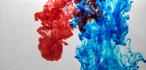 red and blue ink in water