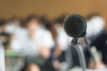 Microphone voice speaker with audiences or students in seminar classroom, lecture hall or conference meeting in educational business event for host, teacher, or coaching mentor