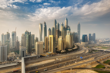 Fototapeta na wymiar Scenic panoramic view of modern city. Aerial daytime skyline of Dubai Marina, UAE, with skyscrapers. Summer travel background.
