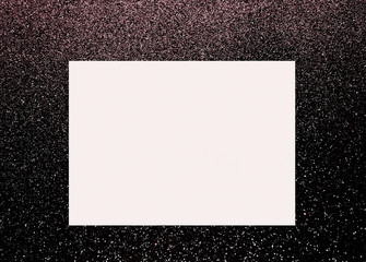 A shiny black background with a blank white square box for text 