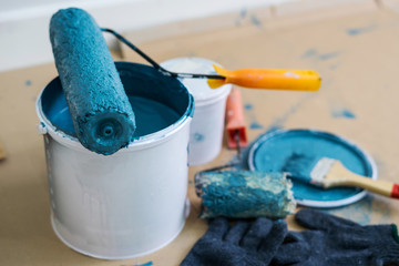 Paint bucket with roller, glove and brush