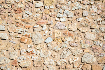 Background from a rough wall made of natural stone
