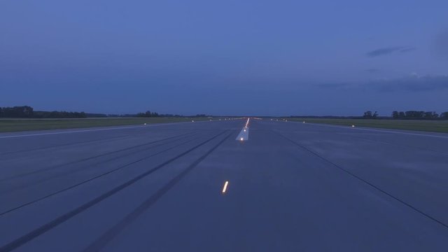 Airplane accelerates over the runway - POV