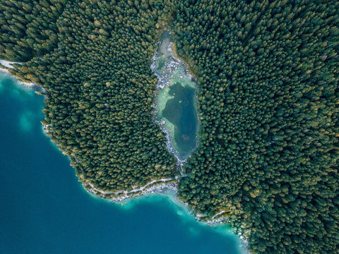 Lake Eibsee in south Germany with large forest and hidden lakes after sunset