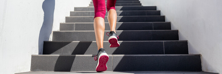 Hiit workout cardio running up the stairs training. Staircase climbing run woman going run up steps panorama banner. Runner athlete doing cardio sport workout. Activewear leggings and shoes. - obrazy, fototapety, plakaty