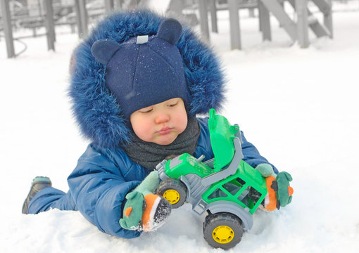 A small child plays on the Playground.
