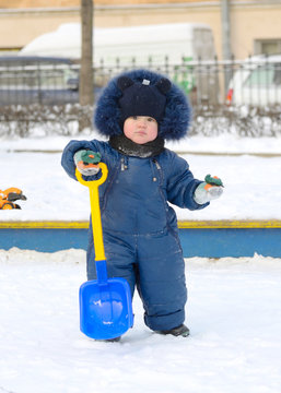 A small child plays on the Playground.